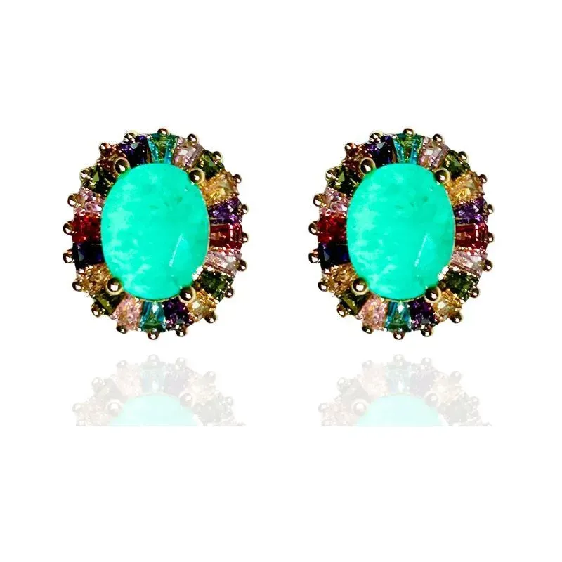 BRINCO OVAL COM BAGUETES EM VOLTA DA PEDRA