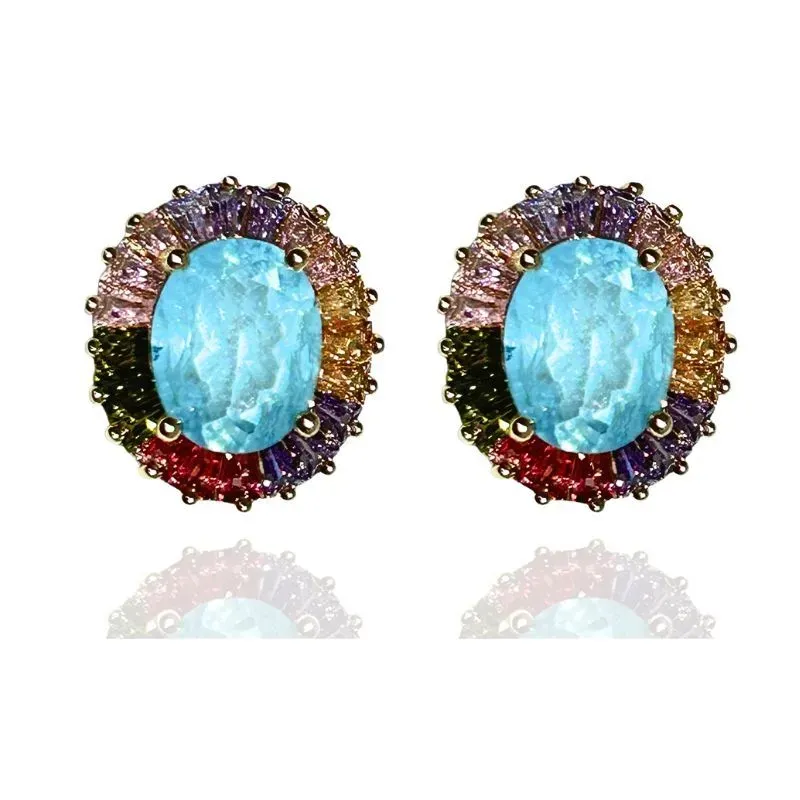 BRINCO OVAL COM BAGUETES EM VOLTA DA PEDRA