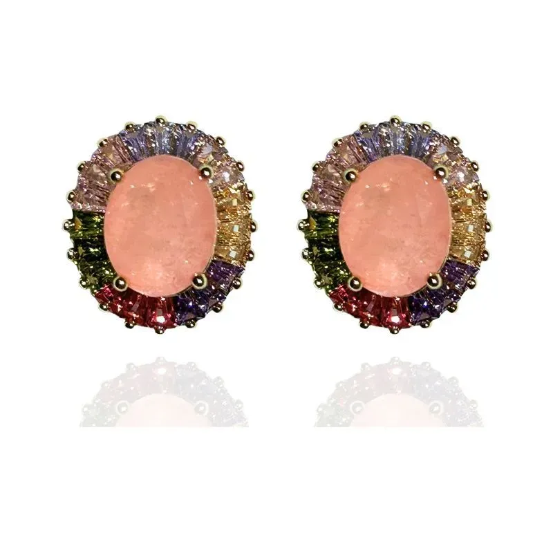 BRINCO OVAL COM BAGUETES EM VOLTA DA PEDRA