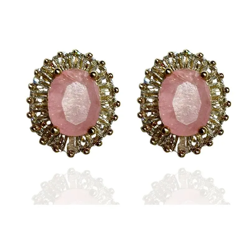 BRINCO OVAL COM BAGUETES EM VOLTA DA PEDRA