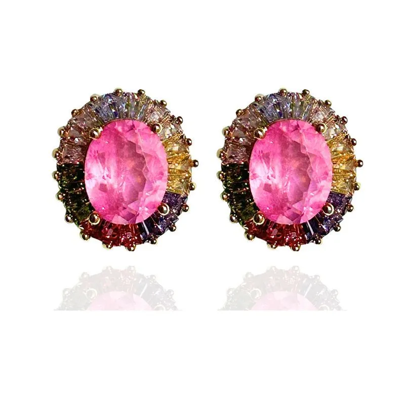 BRINCO OVAL COM BAGUETES EM VOLTA DA PEDRA