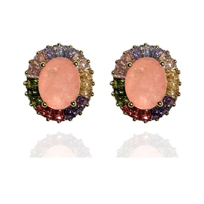 BRINCO OVAL COM BAGUETES EM VOLTA DA PEDRA